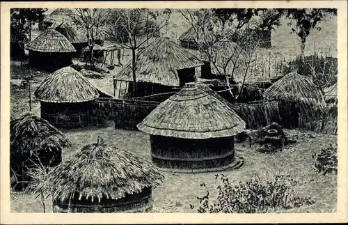 Ak Rhodesien Simbabwe, Un kraal, Strohhütten