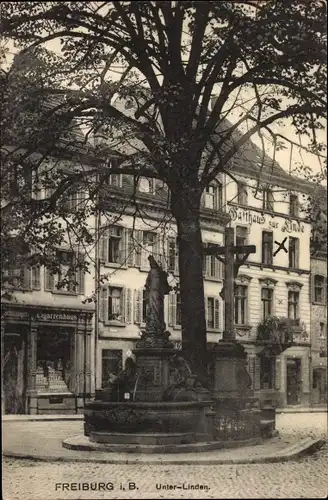 Ak Freiburg im Breisgau, Unter-Linden, Denkmal, Jesuskreuz, Zigarrenhaus, Gasthaus zur Linde