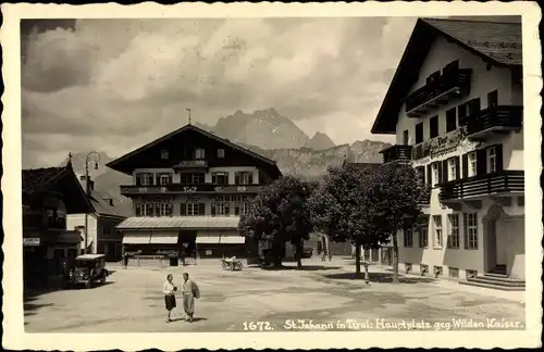 Ak Sankt Johann in Tirol, Hauptplatz gegen Wilden Kaiser, Gasthof, Postgebäude