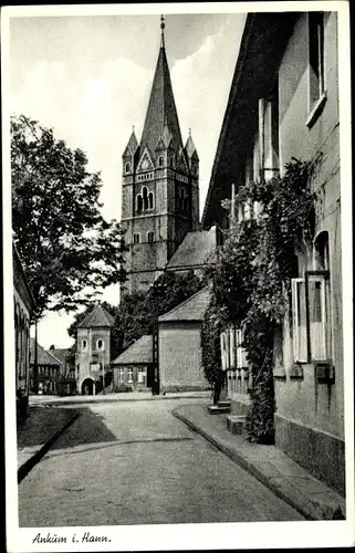 Ak Ankum in Niedersachsen, Straßenpartie mit Blick zur Kirche