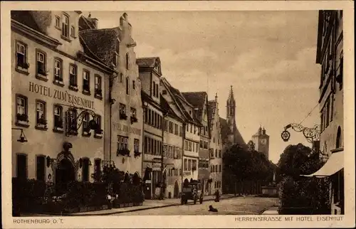 Ak Rothenburg o. T., Herrenstraße mit Hotel zum Eisenhut, Kirchturm