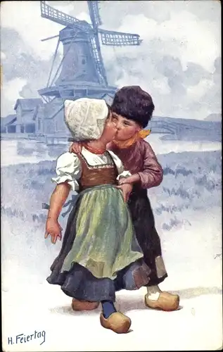 Künstler Ak Feiertag, Karl, Niederländische Volkstrachten, Windmühle, Kinder sich küssend