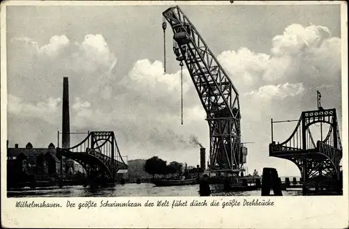 Ak Wilhelmshaven in Niedersachsen, Der größte Schwimmkran der Welt fährt durch die größte Drehbrücke
