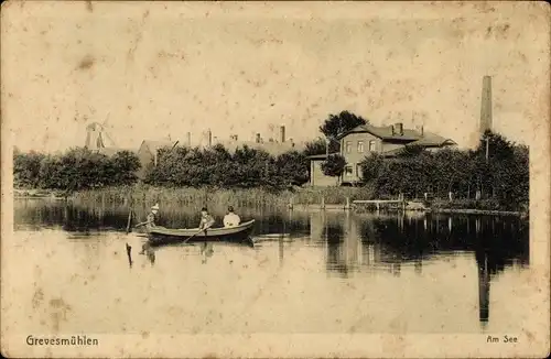 Ak Grevesmühlen in Mecklenburg, Ruderboot auf dem See, Windmühle