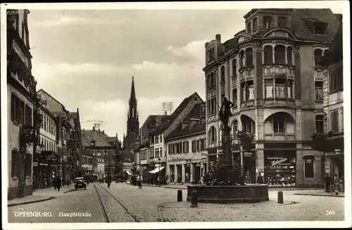 Ak Offenburg in Baden Schwarzwald, Hauptstraße, Brunnen, Geschäfte, Kirchturm