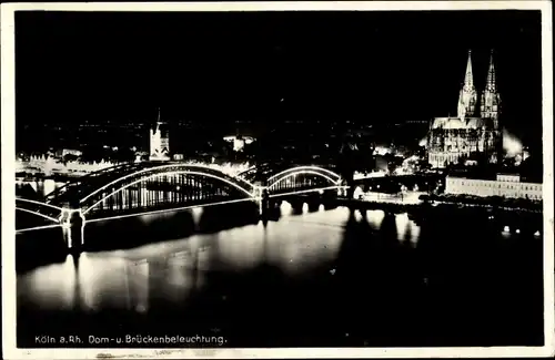 Ak Köln am Rhein, Dom- und Brückenbeleuchtung, bei Nacht