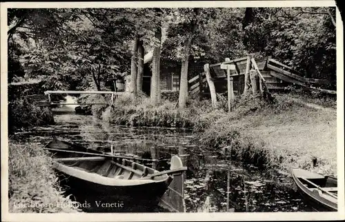 Ak Giethoorn Overijssel Niederlande, Hollands Venetie, Boot in Wasser, Haus, Brücke