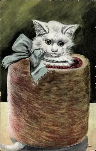 Künstler Ak Wetzel, W., Kätzchen mit Schleife in einem Muff