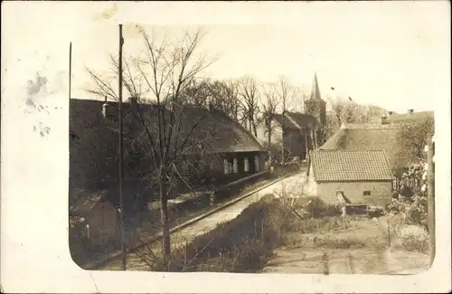 Foto Ak Abbehausen Nordenham in Oldenburg, Straßenpartie, Kirche