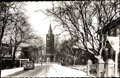 Foto Quickborn in Holstein, Kirche im Winter, Straßenpartie