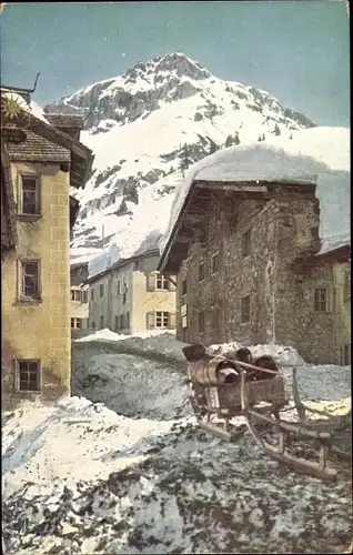 Künstler Ak Stuben am Arlberg Vorarlberg, Straßenpartie im Winter, Schlitten