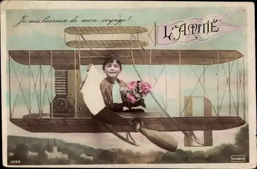 Ak L'Amitie, Junge in einem Flugzeug, Fotomontage, Doppeldecker