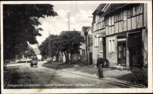 Ak Siebigerode Mansfeld im Harzvorland, Gasthof Goldener Löwe und Hauptstraße