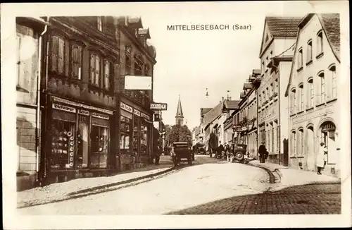 Ak Mittelbesebach Mittelbexbach Bexbach Saarland, Straßenpartie, Spielwarengeschäft, Kirche