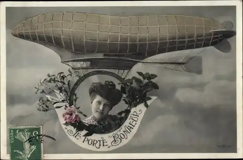 Ak Glückwunsch, Je porte bonheur, Luftschiff, Frauenportrait, Kitsch