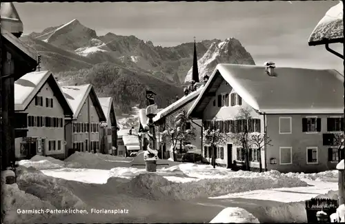 Ak Garmisch Partenkirchen in Oberbayern, Floriansplatz, Berge, Winter, Schnee