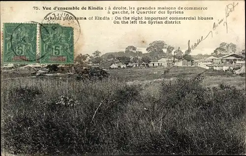 Ak Kindia Guinea, a droite les grandes maisons de commerce, a gauche le Quartier des Syriens