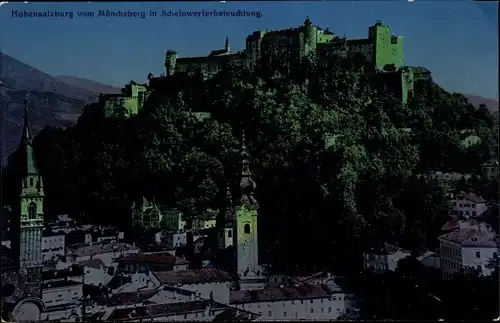 Ak Salzburg in Österreich, Festung Hohensalzburg vom Mönchsberg in Scheinwerferbeleuchtung