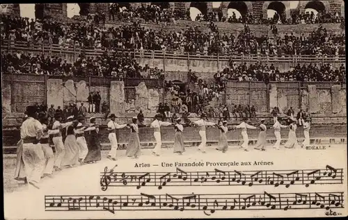 Ak Arles, Une Farandole Provencale aux Arenes, Tanzende Menschen, Stadion, Tracht