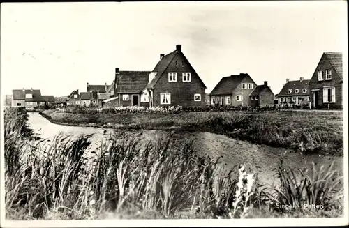 Ak Petten Nordholland, Blick auf den Ort, Fluss, Häuser