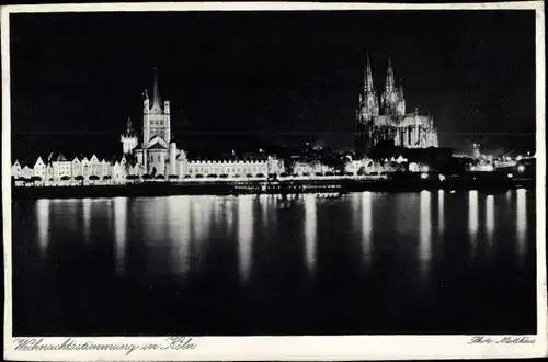 Ak Köln am Rhein, Rheinansicht, Dom bei Nacht, Weihnachtsstimmung