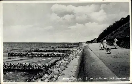 Ak Niechorze Seebad Horst Pommern, Strandpartie an der Ufermauer