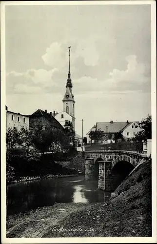 Ak Großpostwitz in Sachsen, Teilansicht mit Brücke, Fluss und Kirchturm