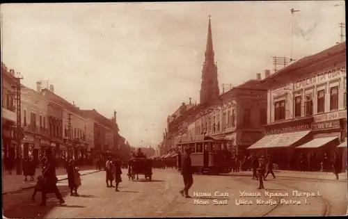 Ak Novi Sad Újvidék Neusatz Serbien, Ulica Kralja Petra I., Straßenbahn, Geschäfte