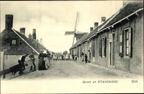 Ak Stavenisse Zeeland, Straßenpartie, Windmühle