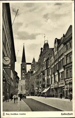 Ak Halberstadt am Harz, Der Breite Weg mit Blick auf die Martinikirche, Geschäfte