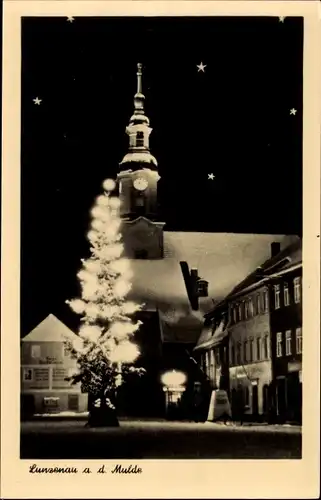 Ak Lunzenau in Sachsen, Kirche bei Nacht, Winter, beleuchteter Baum