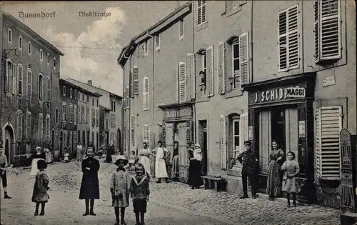 Ak Bouzonville Busendorf Moselle, Niedstraße, Geschäfte, Anwohner