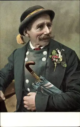 Ak Bauernhochzeit, Mann in Tracht mit Regenschirm