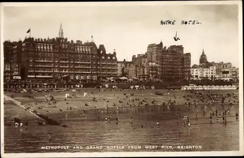 Ak Brighton East Sussex England, Metropole and Grand Hotels from West Pier