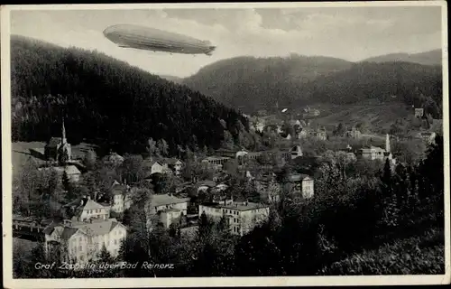 Ak Duszniki Zdrój Bad Reinerz Schlesien, Luftschiff LZ 127 Graf Zeppelin über der Stadt