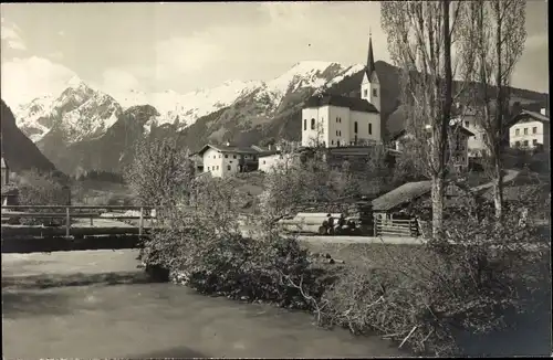 Foto Ak Kaprun in Salzburg, Teilansicht, Kirche, Brücke