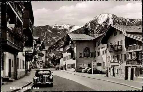 Ak Tegernsee in Oberbayern, Straßenansicht, Gasthof, Geschäfte, Wallberg, Auto