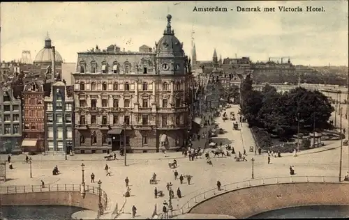 Ak Amsterdam Nordholland Niederlande, Damrak met Victoria Hotel