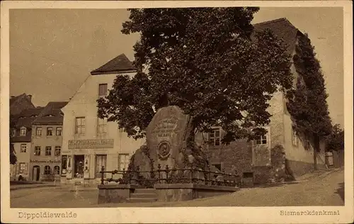 Ak Dippoldiswalde im Erzgebirge, Bismarckdenkmal, Geschäft Künzelmanns Nachflg.