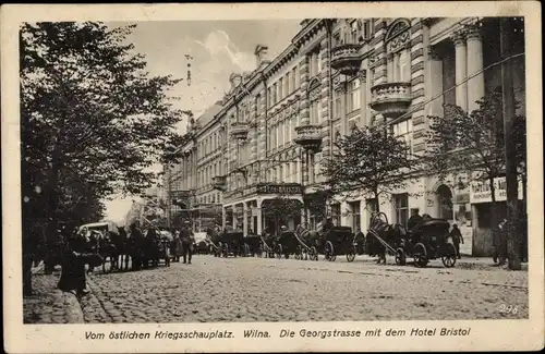 Ak Vilnius Wilna Litauen, Georgstraße mit Hotel Bristol, östlicher Kriegsschauplatz, Armeefuhrwerke