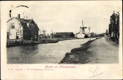 Ak Nieuwendam Amsterdam Nordholland, Ortsansicht, Fluss, Windmühle