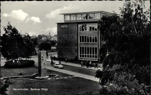 Ak Neumünster in Holstein, Berliner Platz, AEG-Gebäude