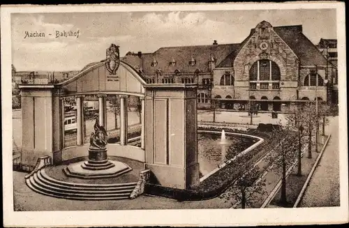 Ak Aachen in Nordrhein Westfalen, Bahnhof, Denkmal, Brunnen