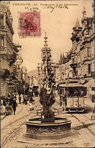 Ak Freiburg im Breisgau, Fischbrunnen in der Kaiserstraße, Straßenbahn