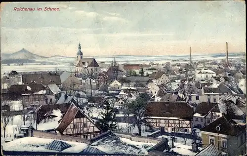 Ak Reichenau Bogatynia Bad Oppelsdorf Schlesien, Blick auf den Ort im Schnee