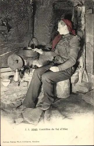 Ak Kanton Wallis, Val d'Illiez, Frau beim Kochen, Schweizerische Tracht