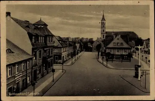 Ak Rothenburg in der Oberlausitz, Straßenpartie mit Kirche, Geschäftshäuser, Klempnerei Max Kapisch