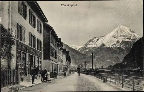 Ak Eisenkappel Vellach in Kärnten, Straßenpartie, Berggipfel, Geschäft