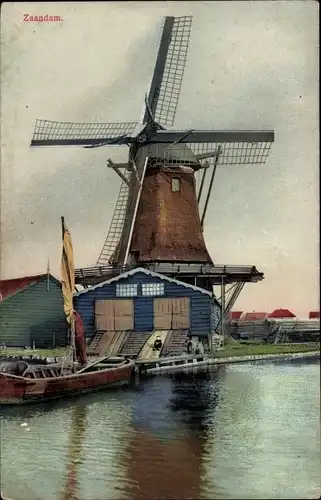 Ak Zaandam Nordholland, Windmühle am Ufer, Boot