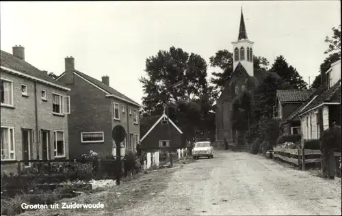 Ak Zuiderwoude Nordholland, Straßenpartie mit Kirche